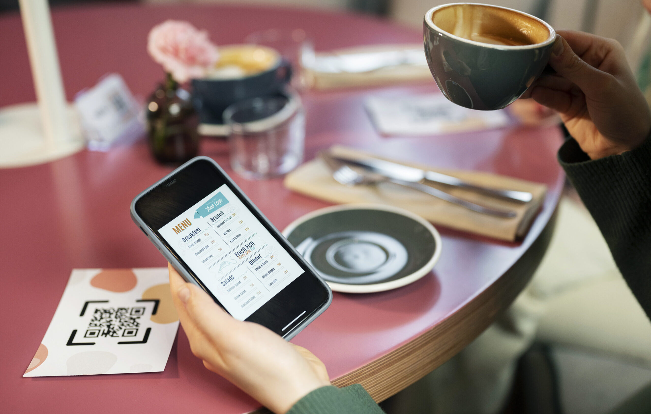 hand holding smartphone with menu