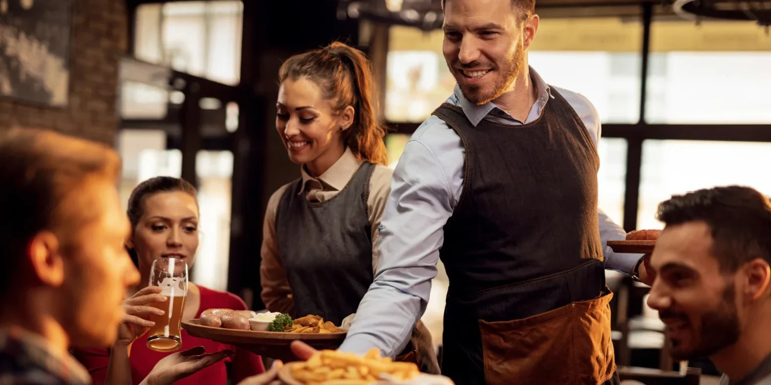 restaurant waiters serving food
