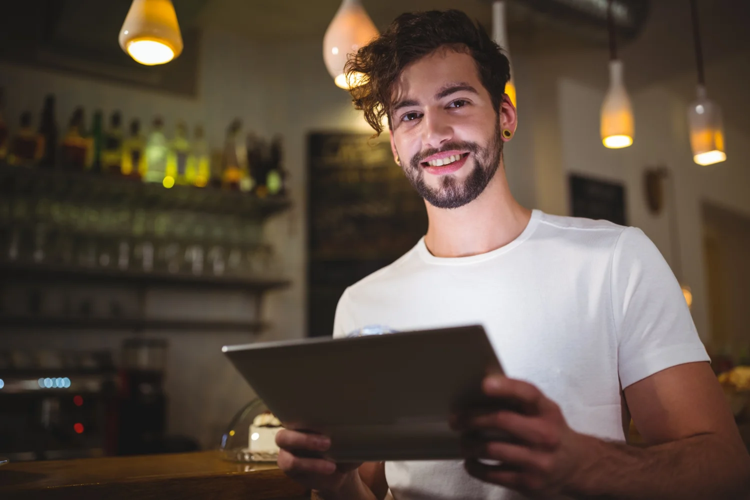 Restaurant owner using digital reservation system in 2025